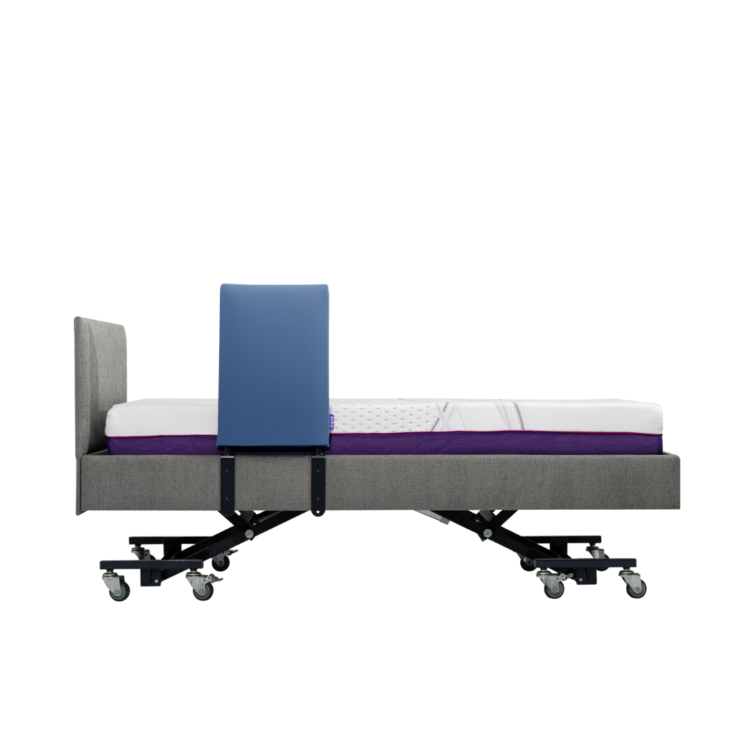 A grey adjustable hospital bed with wheels and a white mattress, featuring an iCare Medical Bed Safety Rail blue vertical safety panel for fall prevention on one side, photographed from the side against a white background.